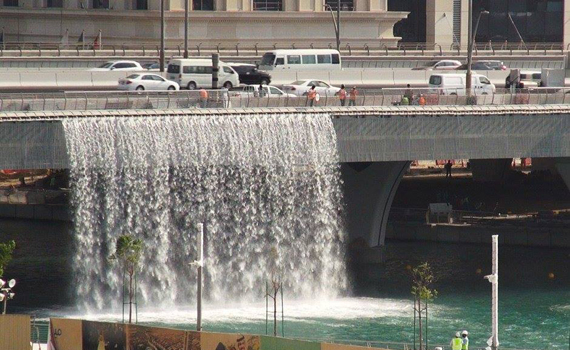 Visit Dubai Water Canal's Waterfall